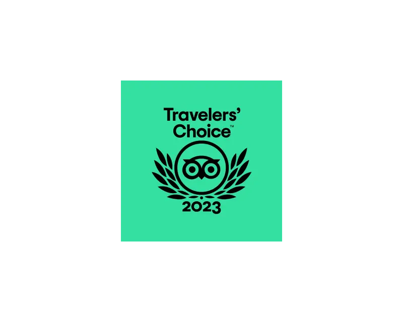 Travelers' Choice award logo for 2023, featuring an owl and laurel wreath on a turquoise background, representing top-rated tours.