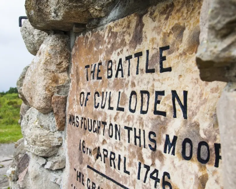 Stone memorial marking the site of the Battle of Culloden, fought on April 16, 1746, with engraved text.