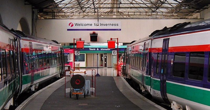 a train pulling into the platform at Inverness train station