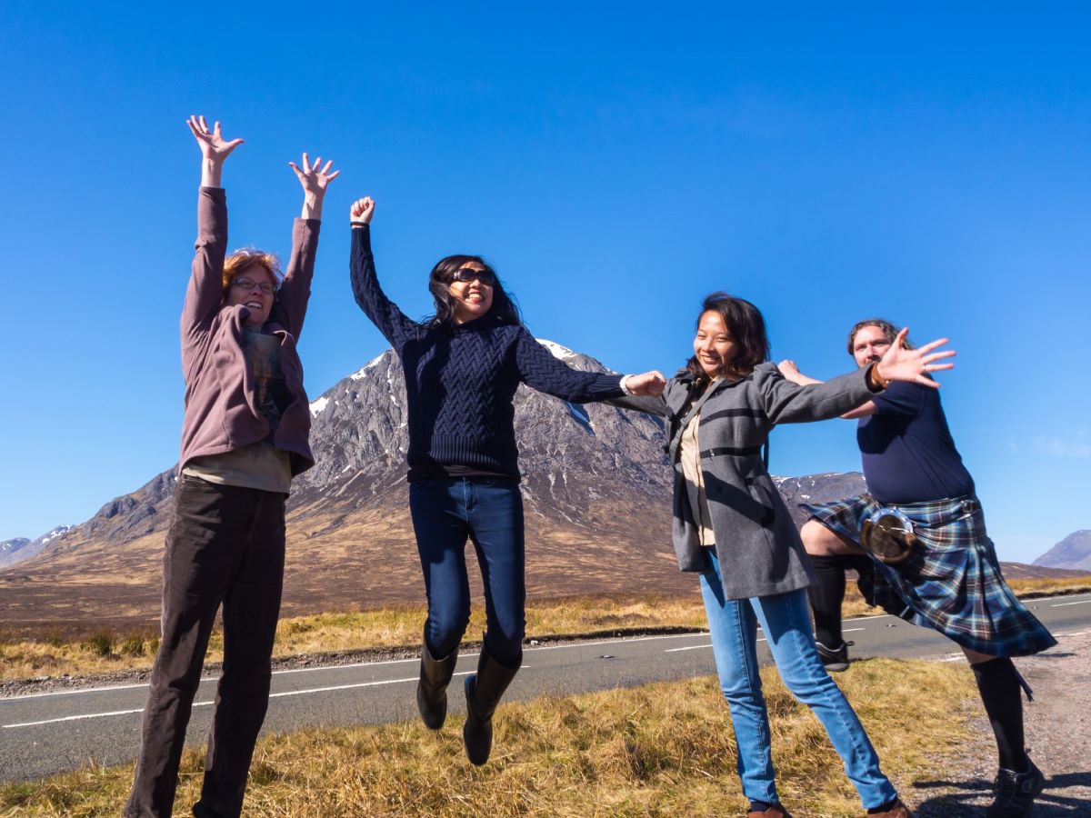 A group of people jumping in the highlands of Scotland