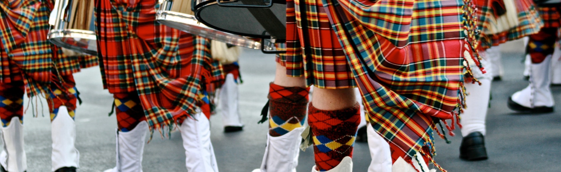 Close up of Scottish tartans worn by a marching band